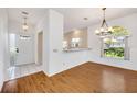 Bright dining area with wood floors and kitchen views at 5803 Garden Lakes Palm, Bradenton, FL 34203