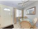Cozy dining area with glass table and wicker chairs at 5938 Welcome Rd # H22, Bradenton, FL 34207
