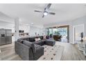 Open living space with sectional sofa and kitchen island view at 6650 Cheswick St, Sarasota, FL 34243