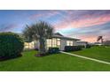 Peaceful backyard with lush landscaping and a view of the community at 6810 9Th W Ave, Bradenton, FL 34209