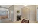 Bright and airy entryway with tile flooring and built-in storage at 6810 9Th W Ave, Bradenton, FL 34209