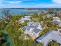 Wide aerial view of the property and surrounding neighborhood at 689 Lands End Dr, Longboat Key, FL 34228