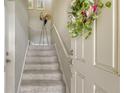 Indoor staircase with carpeted steps and neutral-toned walls at 8115 Miramar Way # 202, Lakewood Ranch, FL 34202