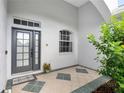 Front entry with a modern door and tiled flooring, welcoming ambiance at 11813 Holly Hock Dr, Lakewood Ranch, FL 34202