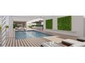 Resort-style pool with pergola, lounge chairs, and lush landscaping at 1305 4Th St # 401B, Sarasota, FL 34236