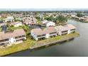 Aerial view of waterfront community with multiple buildings and lush landscaping at 1775 Lake Pl # 1775B, Venice, FL 34293