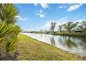 Peaceful canal view with lush landscaping at 1775 Lake Pl # 1775B, Venice, FL 34293