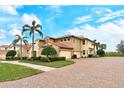Luxury home with three-car garage and brick paver driveway at 206 Bella Vista Ter # 29B, North Venice, FL 34275