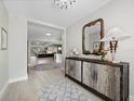 Inviting entryway with decorative mirror, leading to an open floor plan and bright living spaces at 2550 Harbourside Dr # 322, Longboat Key, FL 34228
