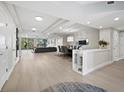 Spacious living and dining area with a modern aesthetic and access to an outdoor balcony at 2550 Harbourside Dr # 322, Longboat Key, FL 34228
