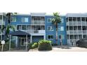 Building exterior showcasing a two-story building with balconies and a covered entrance at 2630 Coconut Bay Ln 2C # 623, Sarasota, FL 34237