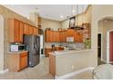 Spacious kitchen featuring wood cabinets and stainless steel appliances at 2773 Harvest Dr, Sarasota, FL 34240