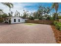 Large brick driveway and fenced backyard at 2826 Marlette St, Sarasota, FL 34231