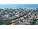 Charming waterfront community showcasing tree lined streets, waterways and homes near the beach and ocean at 3131 Bayou Sound, Longboat Key, FL 34228