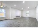 Bright living room with grey tile floors and ceiling fan at 3419 27Th Pkwy, Sarasota, FL 34235