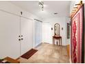 Bright and airy entryway with tiled floors and a cozy rug at 3746 Torrey Pines Blvd, Sarasota, FL 34238
