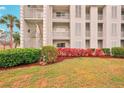Building exterior showcasing landscaping and building features at 404 Cerromar N Cir # 108, Venice, FL 34293