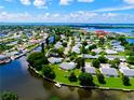 Wide aerial view of waterfront community, showcasing numerous homes and waterways at 4799 Independence Dr, Bradenton, FL 34210