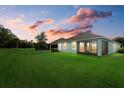 Spacious backyard with a screened patio and lush green grass at 5307 Applegate Ct, Bradenton, FL 34211