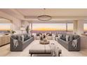 Spacious living room with ocean views and comfortable seating at 70 Avenida Veneccia # 202, Sarasota, FL 34242