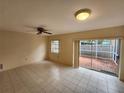 Bright living room with tile floors and sliding glass doors at 975 S Tuttle Ave, Sarasota, FL 34237