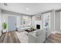 Bright living room with fireplace and hardwood floors at 1010 E Lake Ave, Tampa, FL 33605