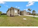 An exterior view of the house with landscaping at 10508 Mcalester Cir, Port Charlotte, FL 33981