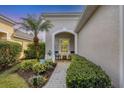 Inviting front porch with seating area and manicured landscaping at 11808 Sawgrass Lake Ter, Bradenton, FL 34211