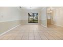 Spacious dining area with tile flooring and large window at 1313 Harbor Blvd, Port Charlotte, FL 33952