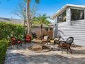 Cozy backyard brick patio featuring comfortable seating for outdoor entertaining and relaxation at 1666 Pintail Way # 9, Sarasota, FL 34231