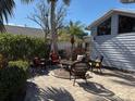 Relaxing patio with wicker furniture and fire pit at 1666 Pintail Way # 9, Sarasota, FL 34231