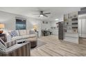 Light and airy living room with a comfortable sofa and a built-in shelf at 1956 Massachusetts Ave, Englewood, FL 34224