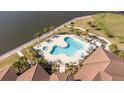 Resort-style pool with lounge chairs and a spa at 2114 5Th E St, Palmetto, FL 34221