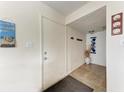 Bright entryway with tiled floor and beach decor at 318 Barlow Ave # 71, Sarasota, FL 34232