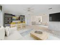 Home bar with wine storage and seating for three at 3530 Tree Line Dr # 4, Sarasota, FL 34231