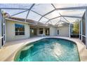 Inviting screened pool and patio area, perfect for relaxation at 4677 Sweetmeadow Cir, Sarasota, FL 34238