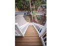 White wooden stairs leading down to the street at 5169 Oxford Dr, Sarasota, FL 34242