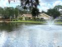 Community pool area with fountain and lush landscaping at 625 30Th W Ave # G409, Bradenton, FL 34205