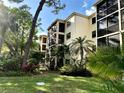 Condo building nestled in tropical landscaping at 625 30Th W Ave # G409, Bradenton, FL 34205