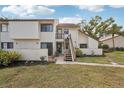 Condo building with stairs leading to individual unit entrances at 712 Bird Bay Dr # 146, Venice, FL 34285