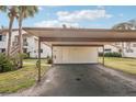 Covered carport parking with additional storage at 712 Bird Bay Dr # 146, Venice, FL 34285