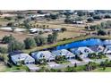 Aerial view showcasing a home and surrounding equestrian community at 7872 Mainsail Ln, Sarasota, FL 34240