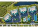 Bird's-eye view of community, highlighting building layout and pool at 9203 Griggs Rd # D103, Englewood, FL 34224