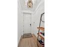 Bright and airy entryway with wood floors and modern shelving at 1703 N Tamiami Trl # 209, Sarasota, FL 34234
