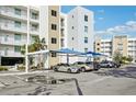 Covered parking area with shade structures for residents at 1703 N Tamiami Trl # 209, Sarasota, FL 34234