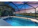 Screened pool and lanai overlooking a canal at 234 River Enclave Ct, Bradenton, FL 34212