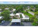 Aerial view of condos with carport and landscaping at 2421 Crispin Ct # E3, Sarasota, FL 34235