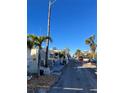 Nice community view, featuring palm trees and a paved road at 2601 Gulf N Dr # 729, Bradenton Beach, FL 34217