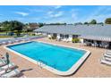 Inviting community pool with lounge chairs at 3701 39Th W St, Bradenton, FL 34205