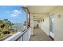 Balcony with water views and access to condo unit at 3810 Gulf Of Mexico Dr # F302, Longboat Key, FL 34228